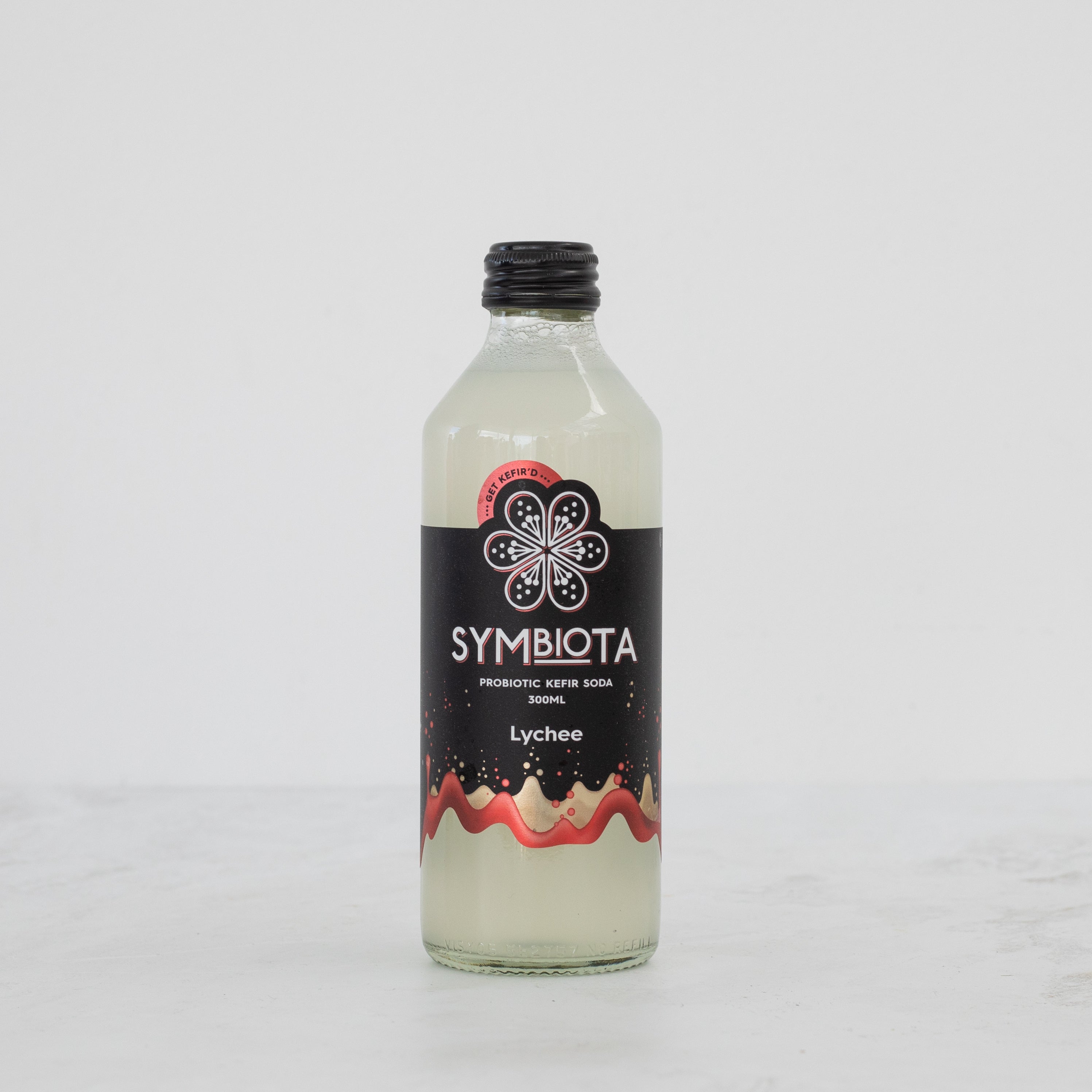 bottle of lychee kefir soda by symbiota