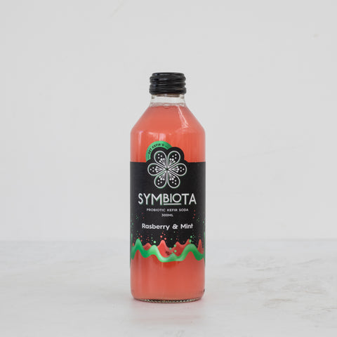 bottle of raspberry mint kefir soda by symbiota